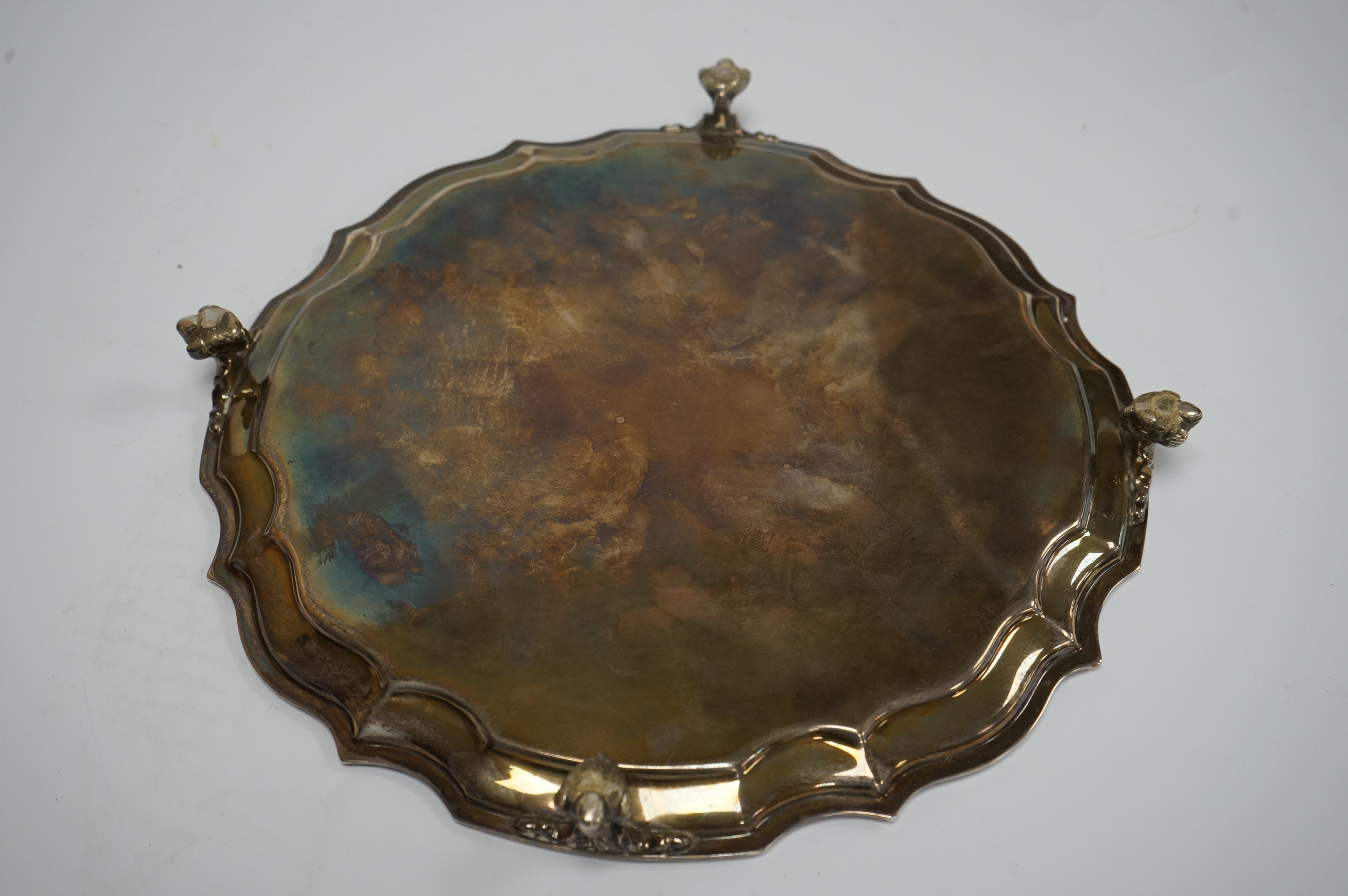 An Elizabeth II silver salver, by Poston Products Ltd, Sheffield, 1952, 25.4cm, with pie crust border, on four claw and ball feet, 17oz. Condition - fair to good